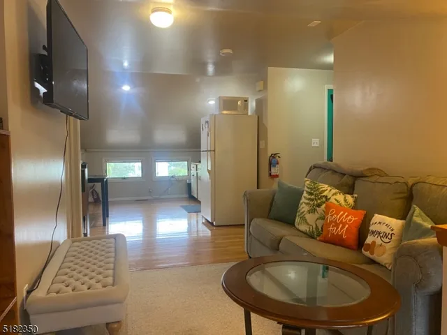 a lobby with furniture and a chandelier