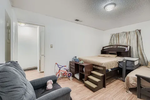 a bedroom with a bed and a couch