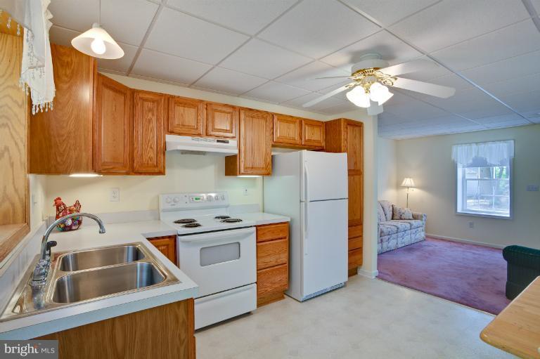 13415 Fork Road Baldwin, MD 21013 - Photo 17 of 29 a kitchen that has a lot of cabinets and refrigerator