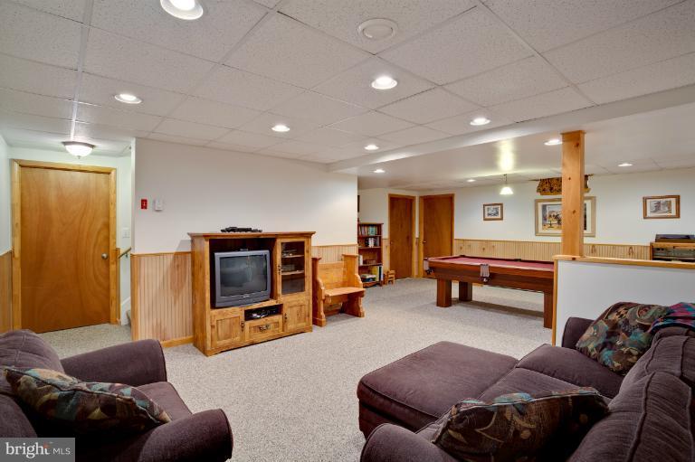 13415 Fork Road Baldwin, MD 21013 - Photo 18 of 29 a living room with furniture and a flat screen tv