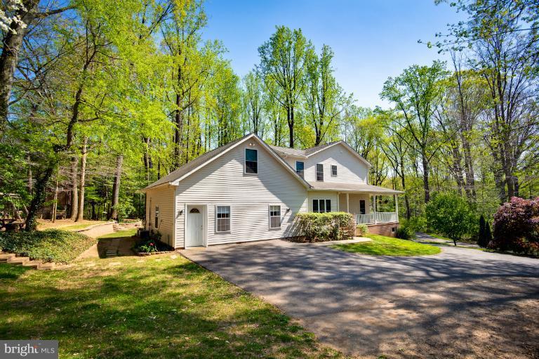 13415 Fork Road Baldwin, MD 21013 - Photo 20 of 29 a view of a white house with a big yard and large trees