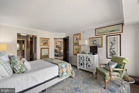 a bedroom with a bed and a couch