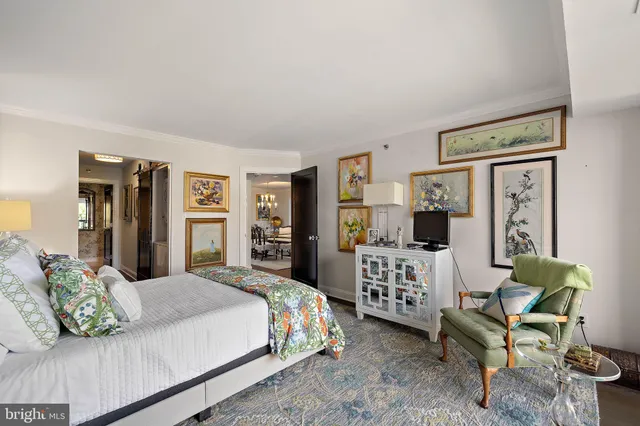 a bedroom with a bed and a couch