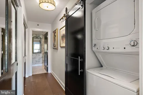 a view of a hallway with wooden shelves