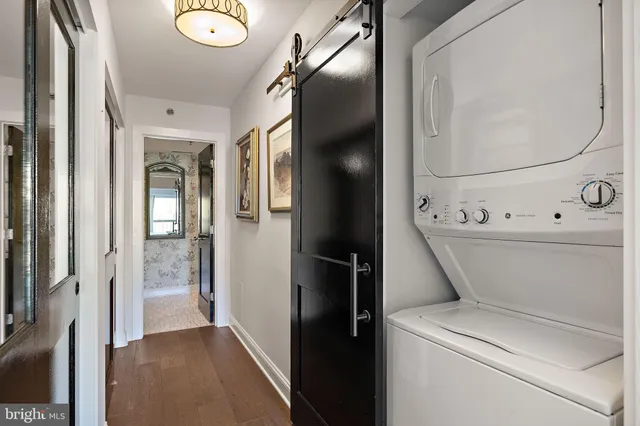 a view of a hallway with wooden shelves