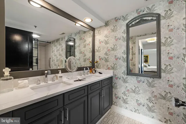 a bathroom with a sink double vanity and a mirror