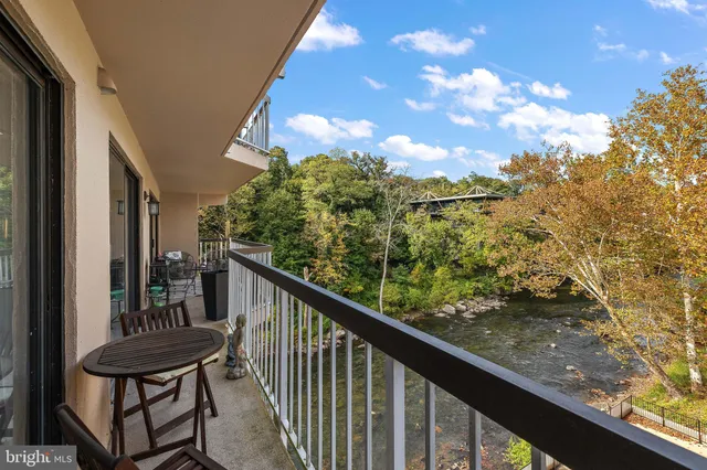 a view of a balcony with chairs