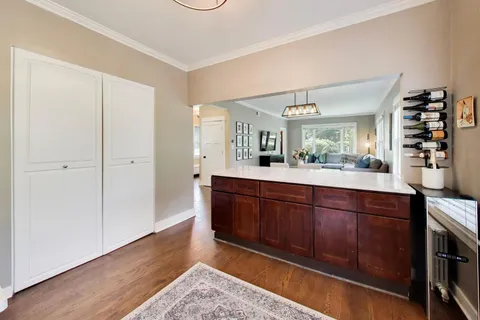 a spacious bathroom with a sink and a large mirror