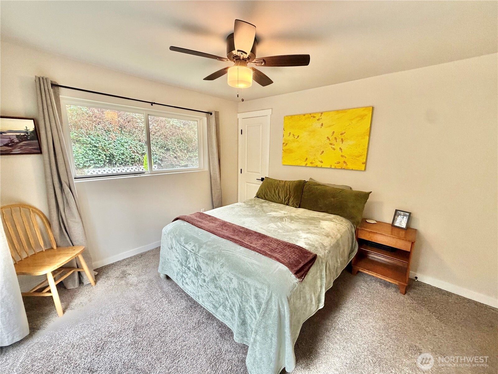 1608 South Evans Street Aberdeen, WA 98520 - Photo 16 of 20 a bedroom with a bed and wooden floor