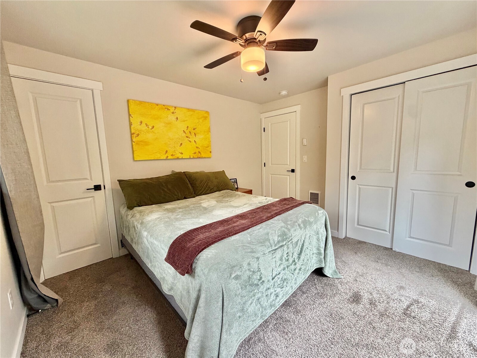 1608 South Evans Street Aberdeen, WA 98520 - Photo 17 of 20 a bedroom with a bed and a ceiling fan