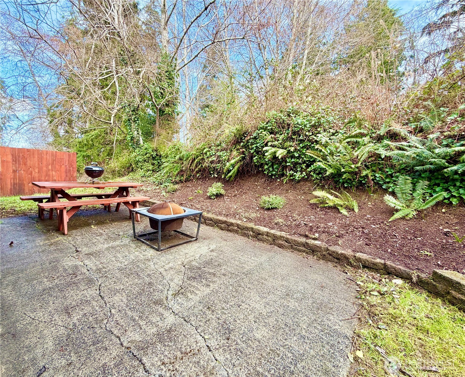 1608 South Evans Street Aberdeen, WA 98520 - Photo 20 of 20 a backyard of a house with a yard and outdoor seating