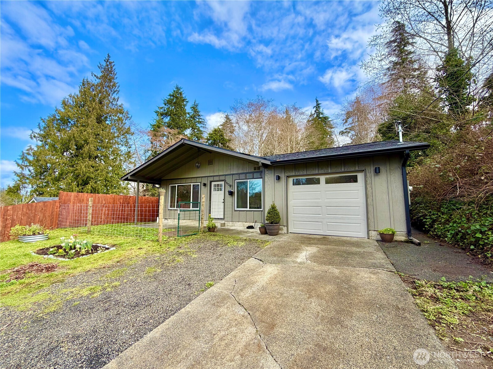 1608 South Evans Street Aberdeen, WA 98520 - Photo 2 of 20 a front view of a house with a yard and garage