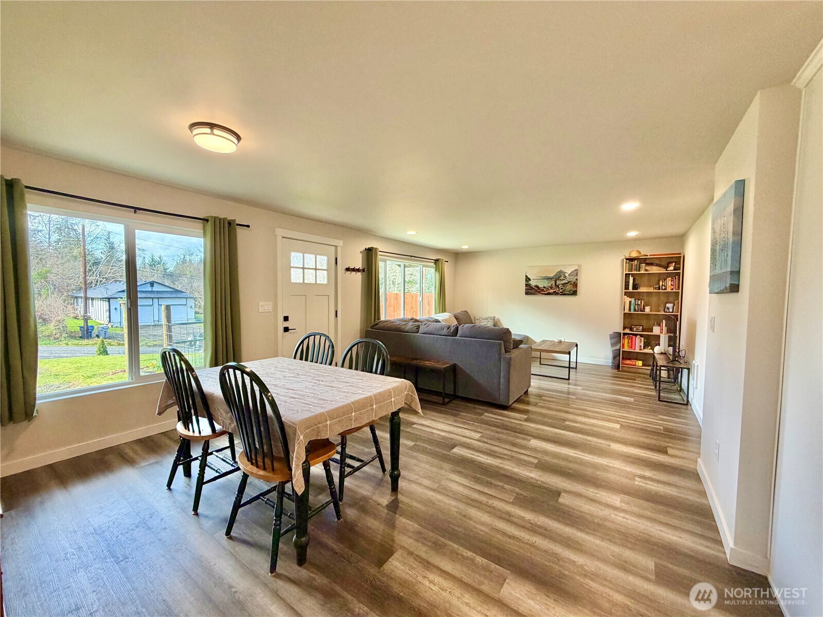 1608 South Evans Street Aberdeen, WA 98520 - Photo 5 of 20 a living room with furniture a flat screen tv and a large window