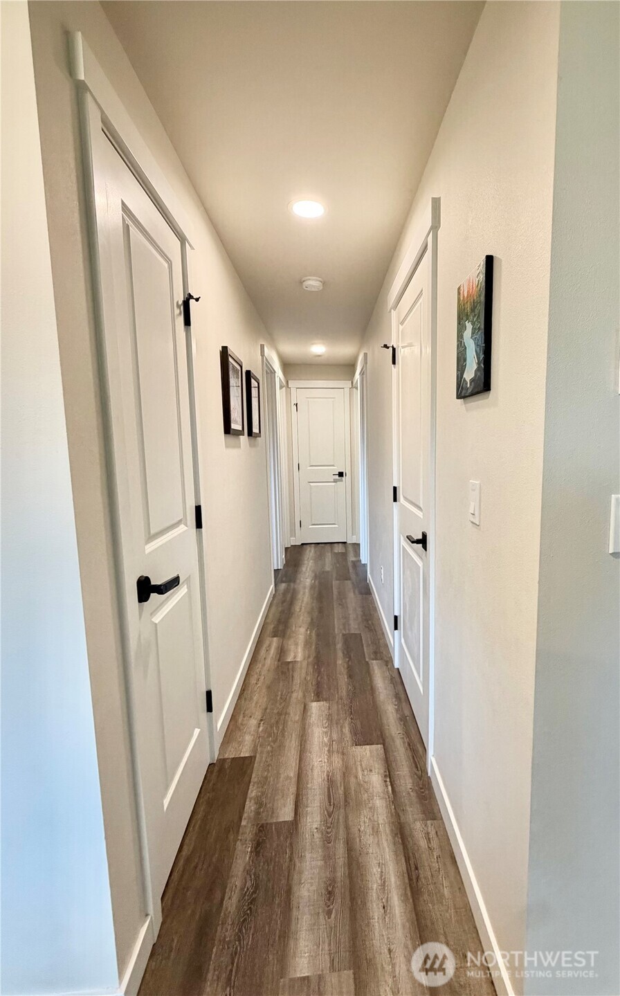 1608 South Evans Street Aberdeen, WA 98520 - Photo 9 of 20 a view of a hallway with wooden floor and staircase