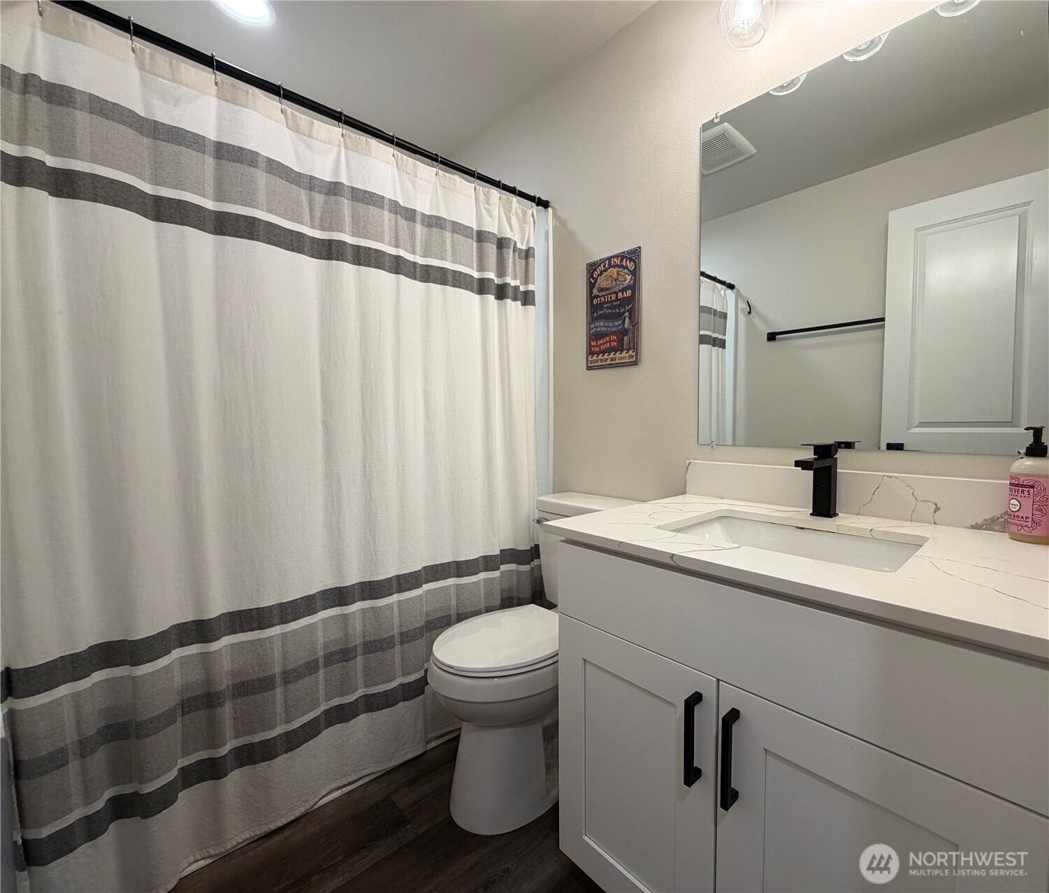 1608 South Evans Street Aberdeen, WA 98520 - Photo 10 of 20 a bathroom with a granite countertop sink and a mirror