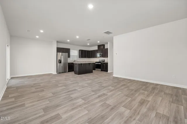 a view of kitchen with wooden floor