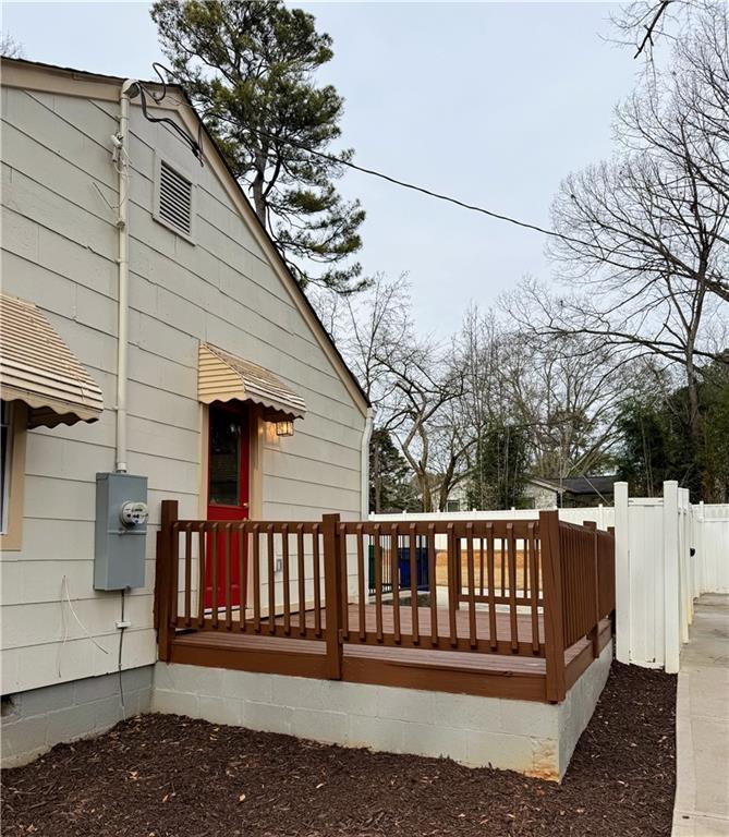 649 Valley Brook Road Scottdale, GA 30079 - Photo 17 of 18 a view of a house with a deck