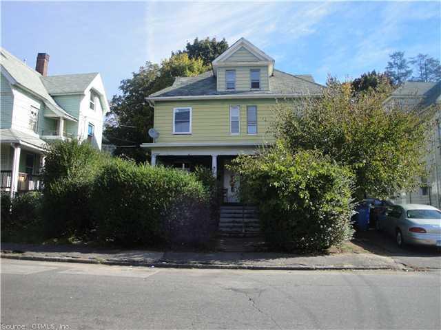 90 Waterville Street Waterbury, CT 06710 - Photo 1 of 1 a front view of a house with a yard