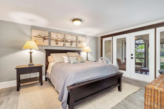 a bedroom with a bed and a lamp on table