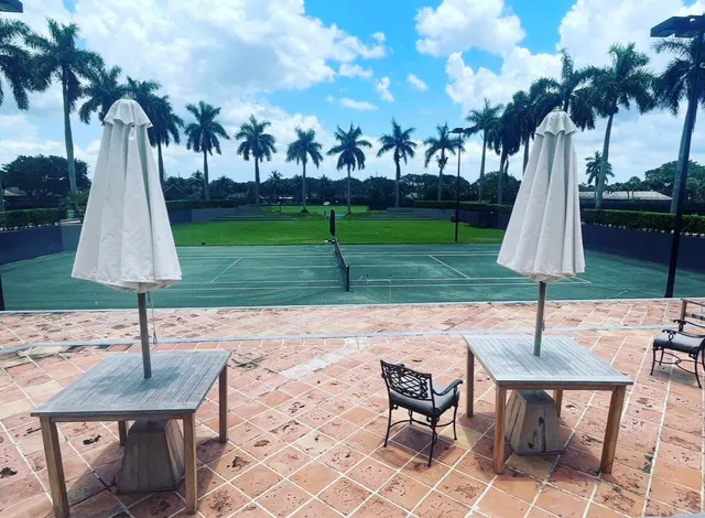 a very nice looking dining room with furniture