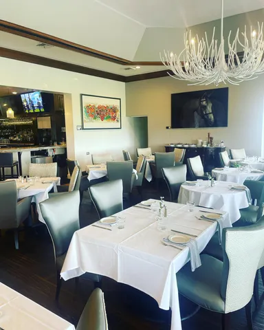 an outdoor sitting area with golf course