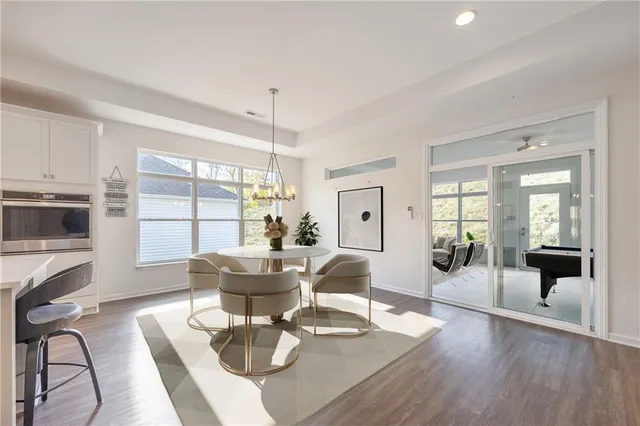 a living room with fireplace furniture and a large window