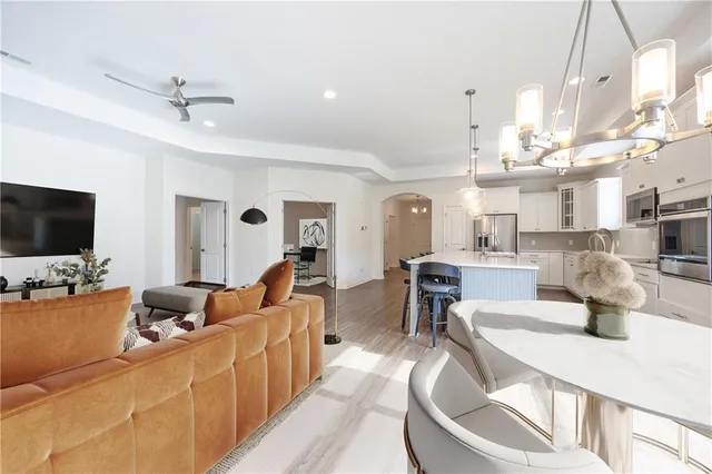 a living room with lots of furniture and a flat screen tv