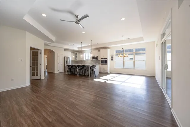 a view of a livingroom with furniture wooden floor and window