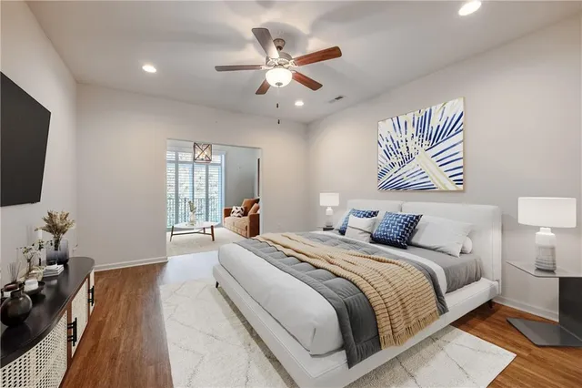 a bed room with bed and a chandelier