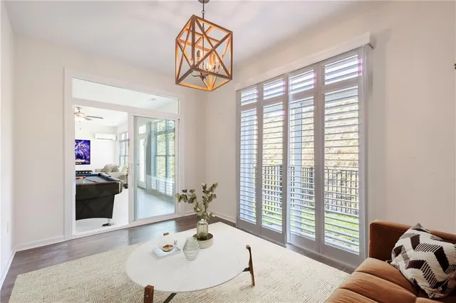 a view of a livingroom with furniture and windows