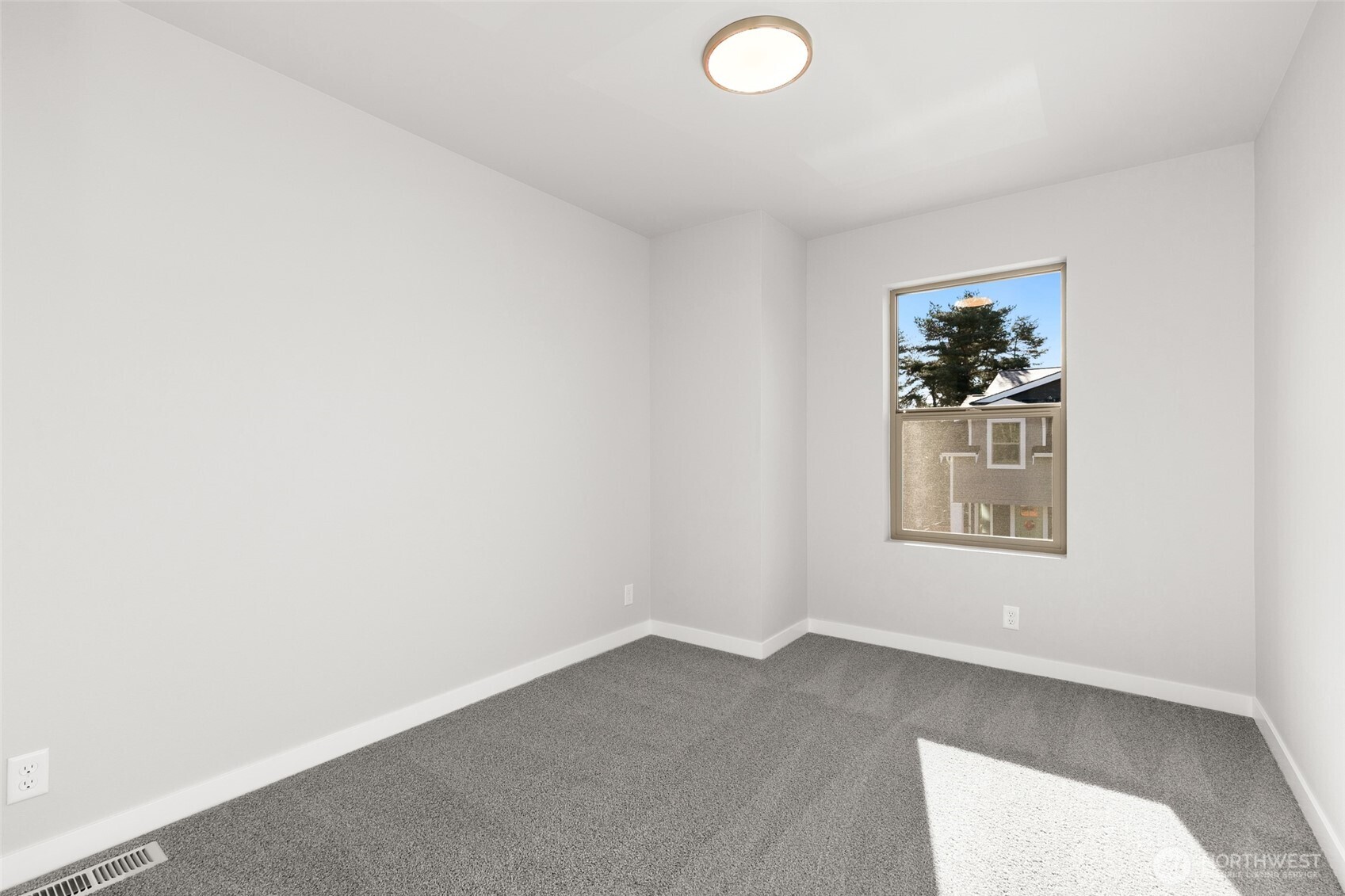 12510 Southeast 256th Place, Unit 7 Kent, WA 98030 - Photo 23 of 39 an empty room with a window