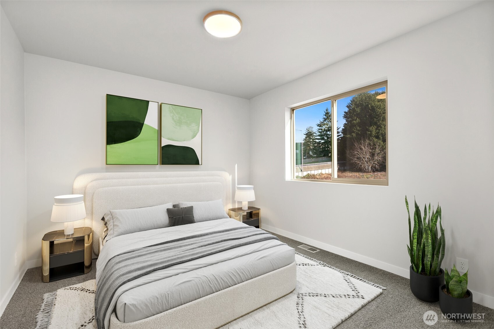 12510 Southeast 256th Place, Unit 7 Kent, WA 98030 - Photo 24 of 39 a bedroom with a bed and a painting on the wall