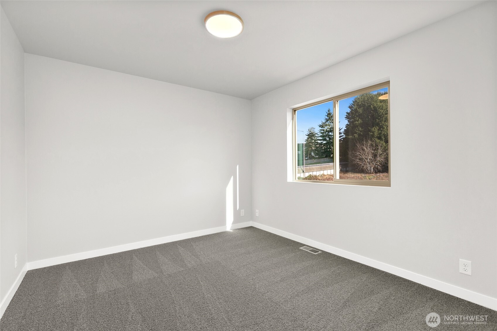 12510 Southeast 256th Place, Unit 7 Kent, WA 98030 - Photo 25 of 39 an empty room with a window