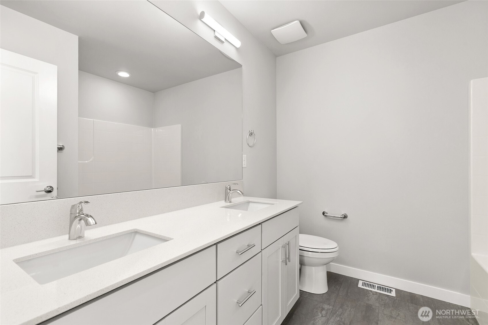 12510 Southeast 256th Place, Unit 7 Kent, WA 98030 - Photo 27 of 39 a bathroom with a sink a toilet and mirror