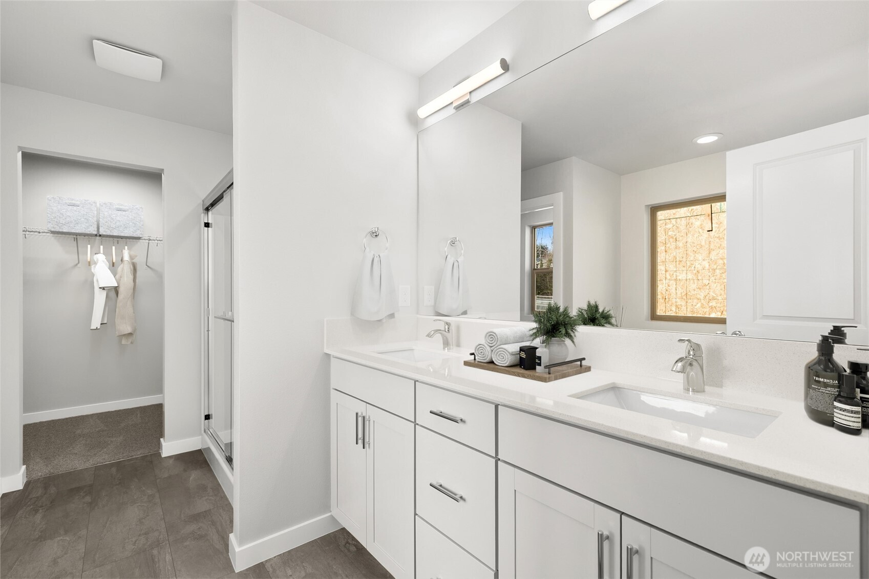 12510 Southeast 256th Place, Unit 7 Kent, WA 98030 - Photo 28 of 39 a bathroom with double sink and a mirror