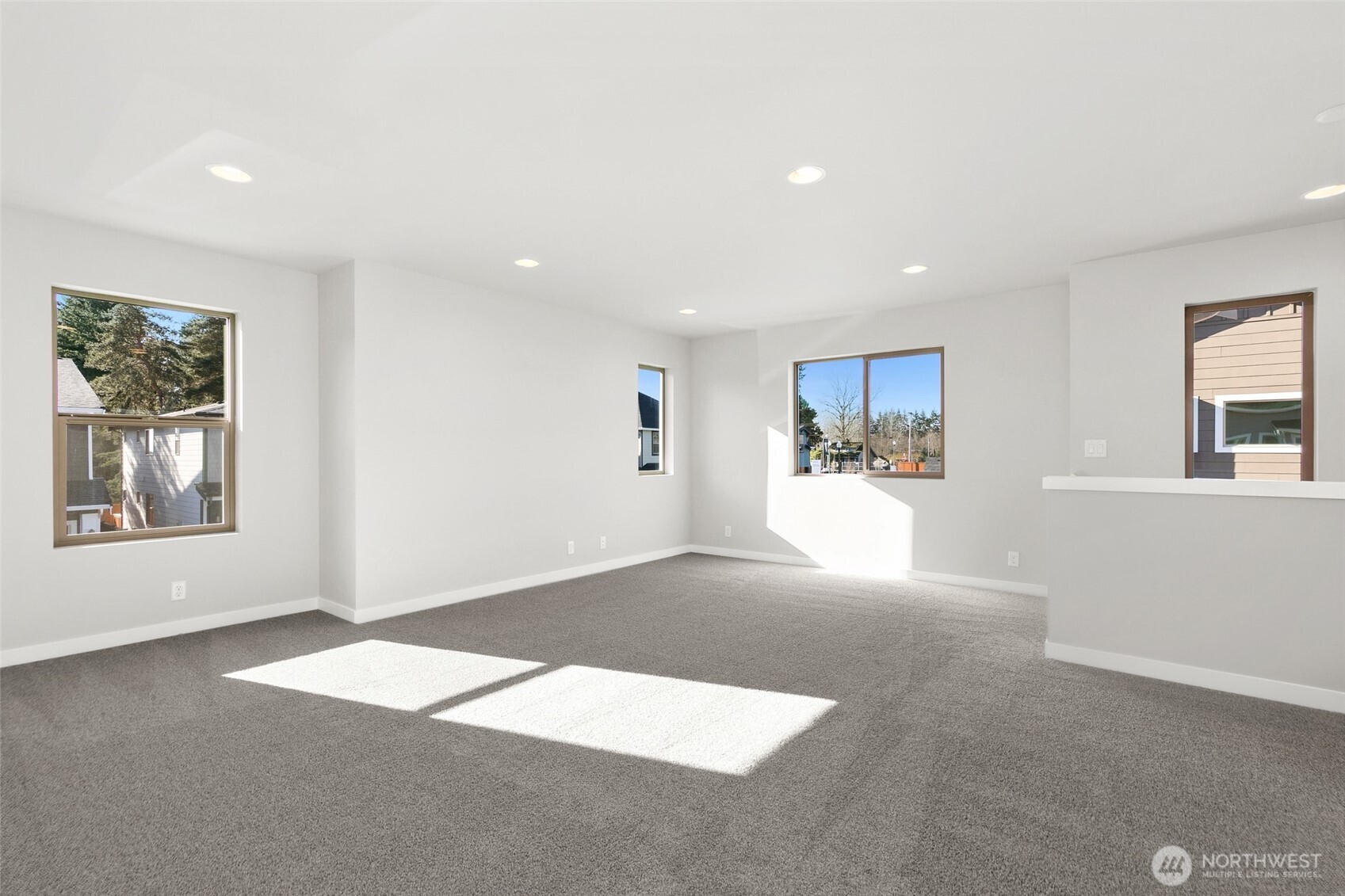 12510 Southeast 256th Place, Unit 7 Kent, WA 98030 - Photo 34 of 39 a view of a big room with windows and chandelier
