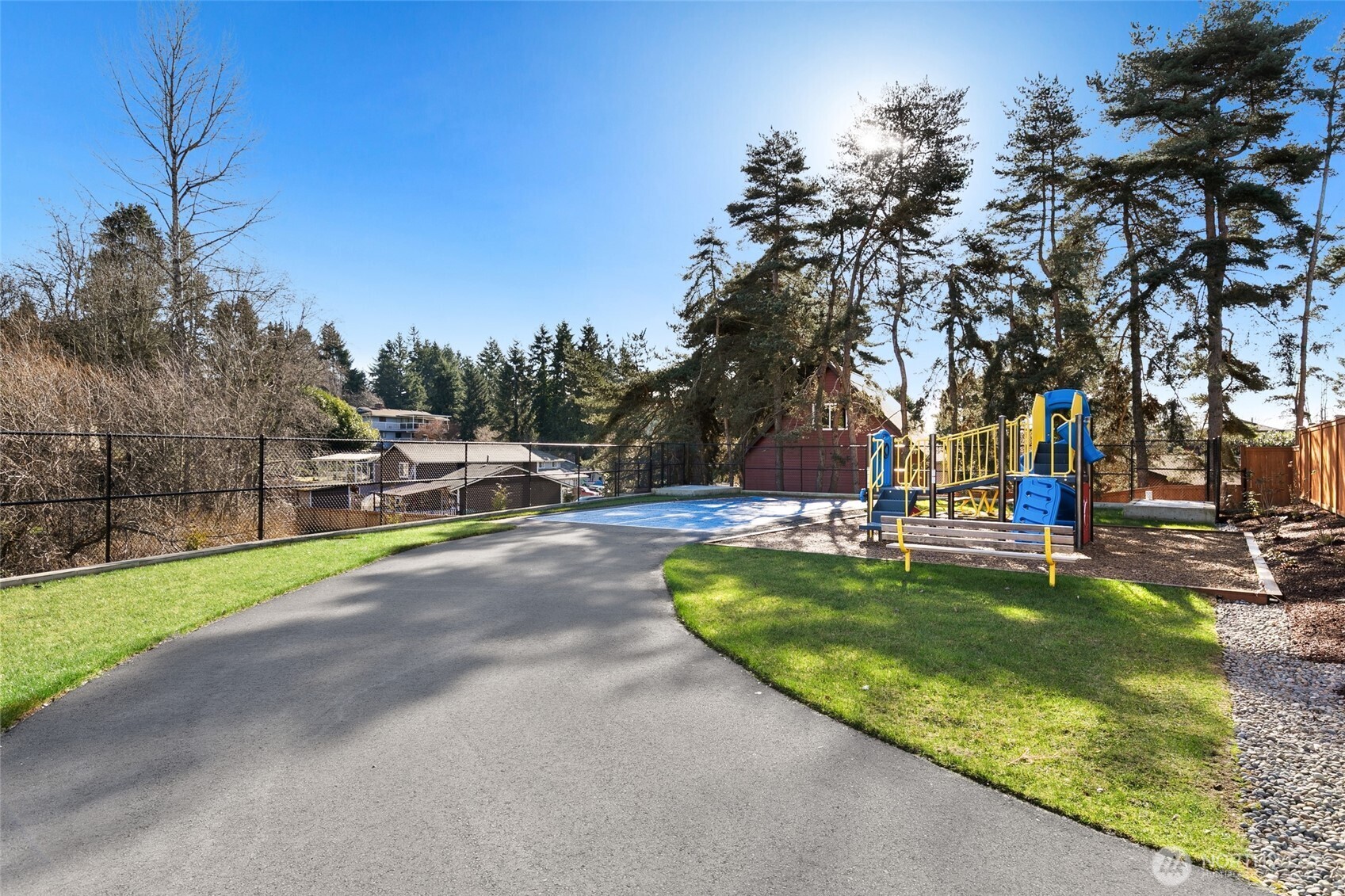 12510 Southeast 256th Place, Unit 7 Kent, WA 98030 - Photo 37 of 39 a view of a swimming pool with a patio