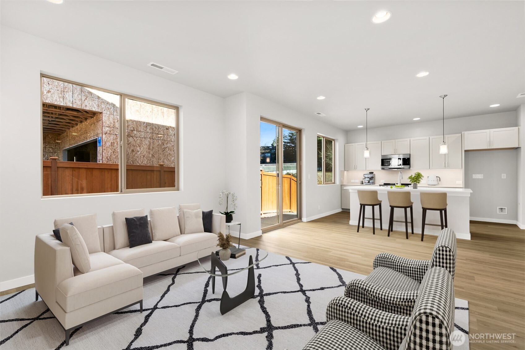 12510 Southeast 256th Place, Unit 7 Kent, WA 98030 - Photo 10 of 39 a living room with furniture and kitchen view