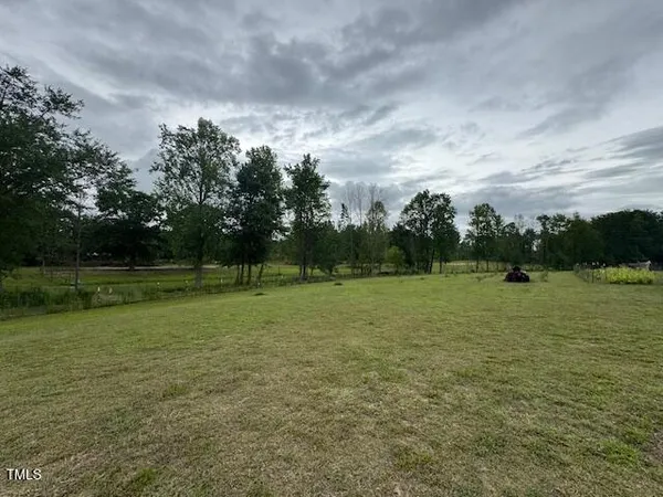 a view of a golf course with a lake