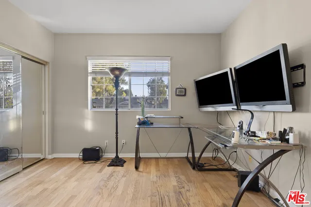a view of a livingroom with furniture and a flat screen tv