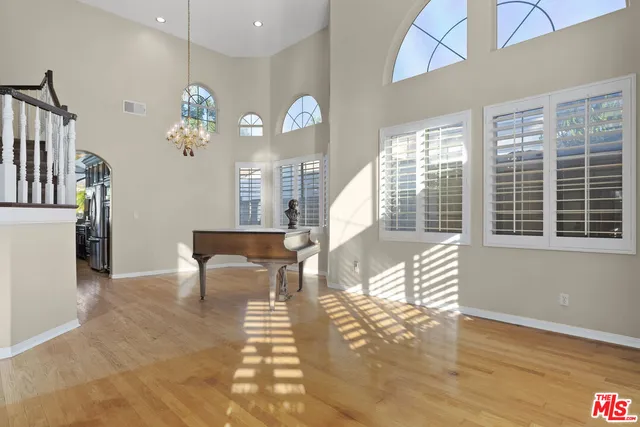 a view of a livingroom with furniture window and wooden floor