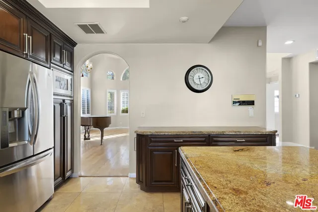 a view of a kitchen with a stove and a refrigerator