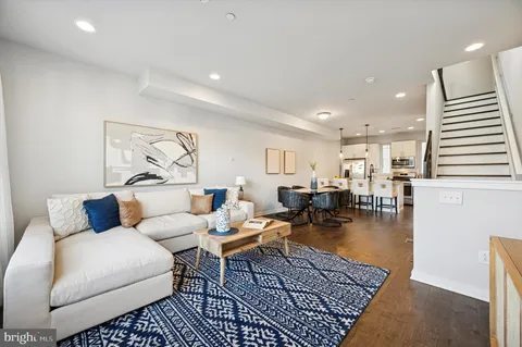 a living room with furniture and a rug