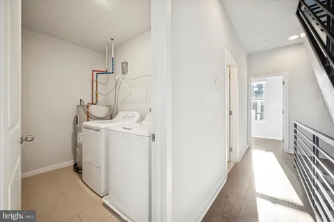a view of a storage & utility room with a sink