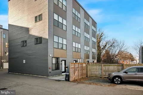 a view of a car park in front of a building