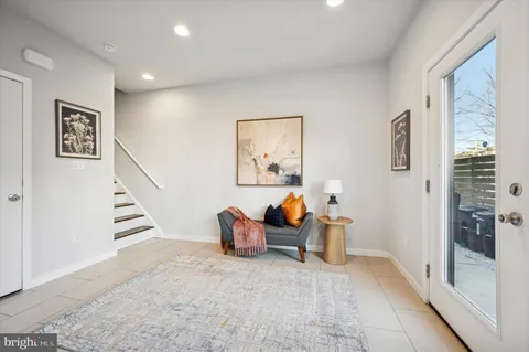 a view of a livingroom with furniture and toys