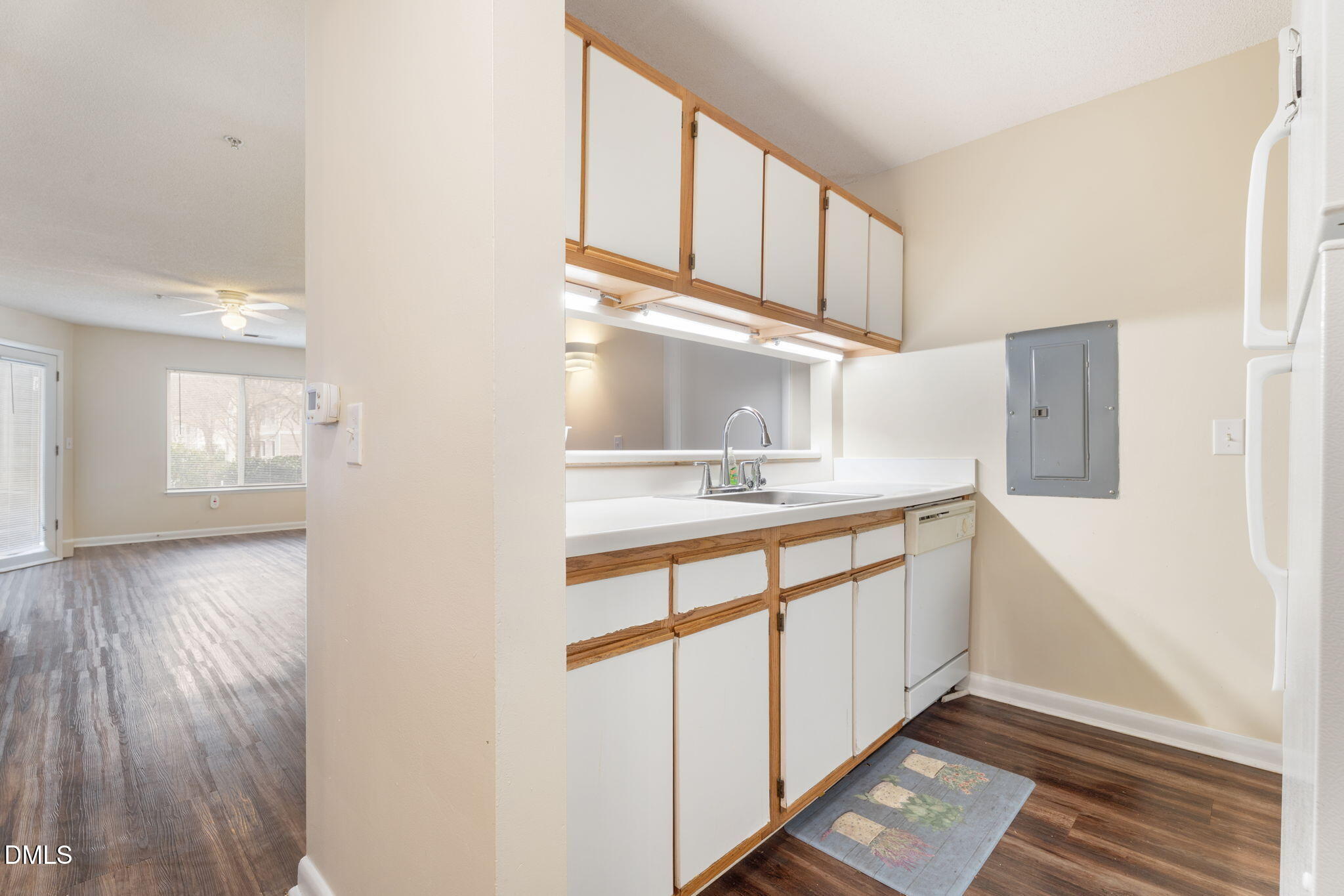 1420 Collegiate Circle Raleigh, NC 27606 - Photo 14 of 30 a kitchen with stainless steel appliances granite countertop a refrigerator a stove and white cabinets with wooden floor