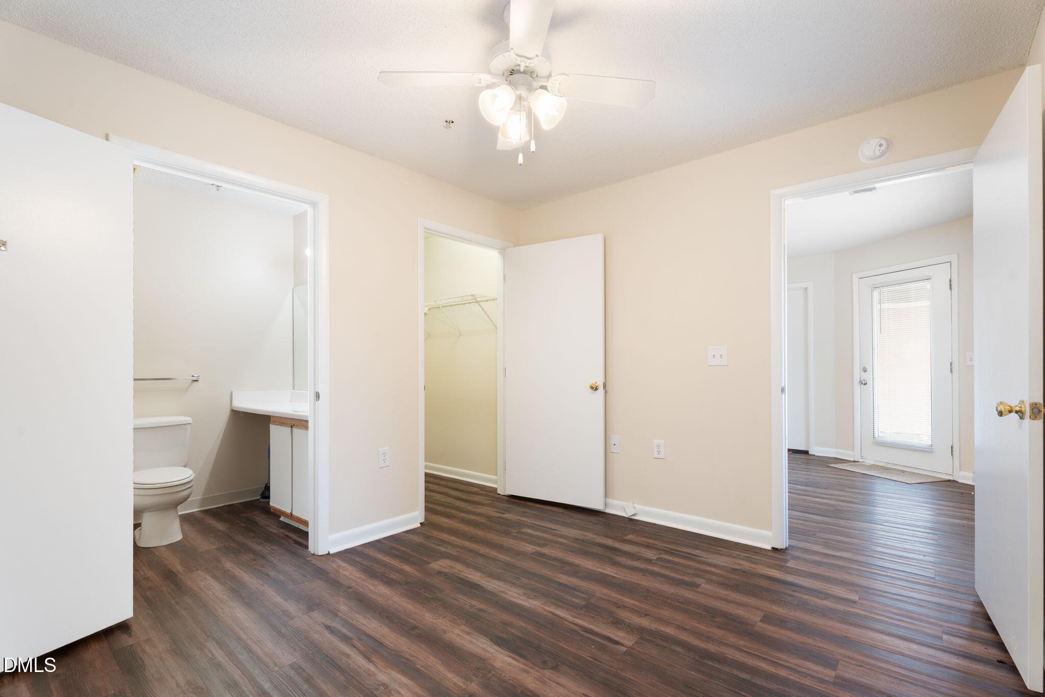 1420 Collegiate Circle Raleigh, NC 27606 - Photo 19 of 30 a view of a room with wooden floor and a ceiling fan