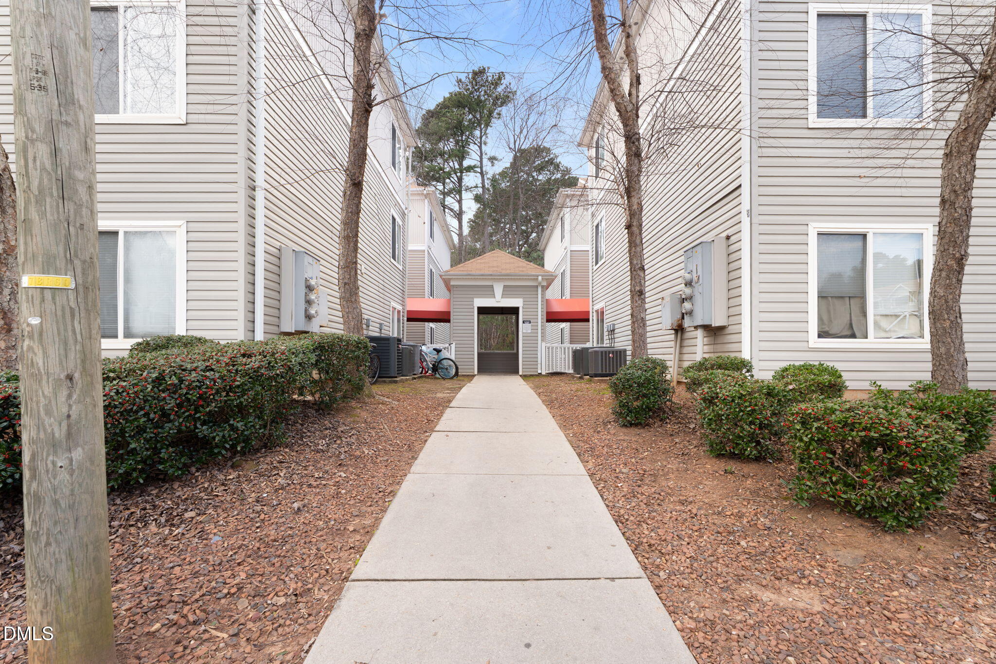 1420 Collegiate Circle Raleigh, NC 27606 - Photo 2 of 30 a front view of a house with a garden and plants