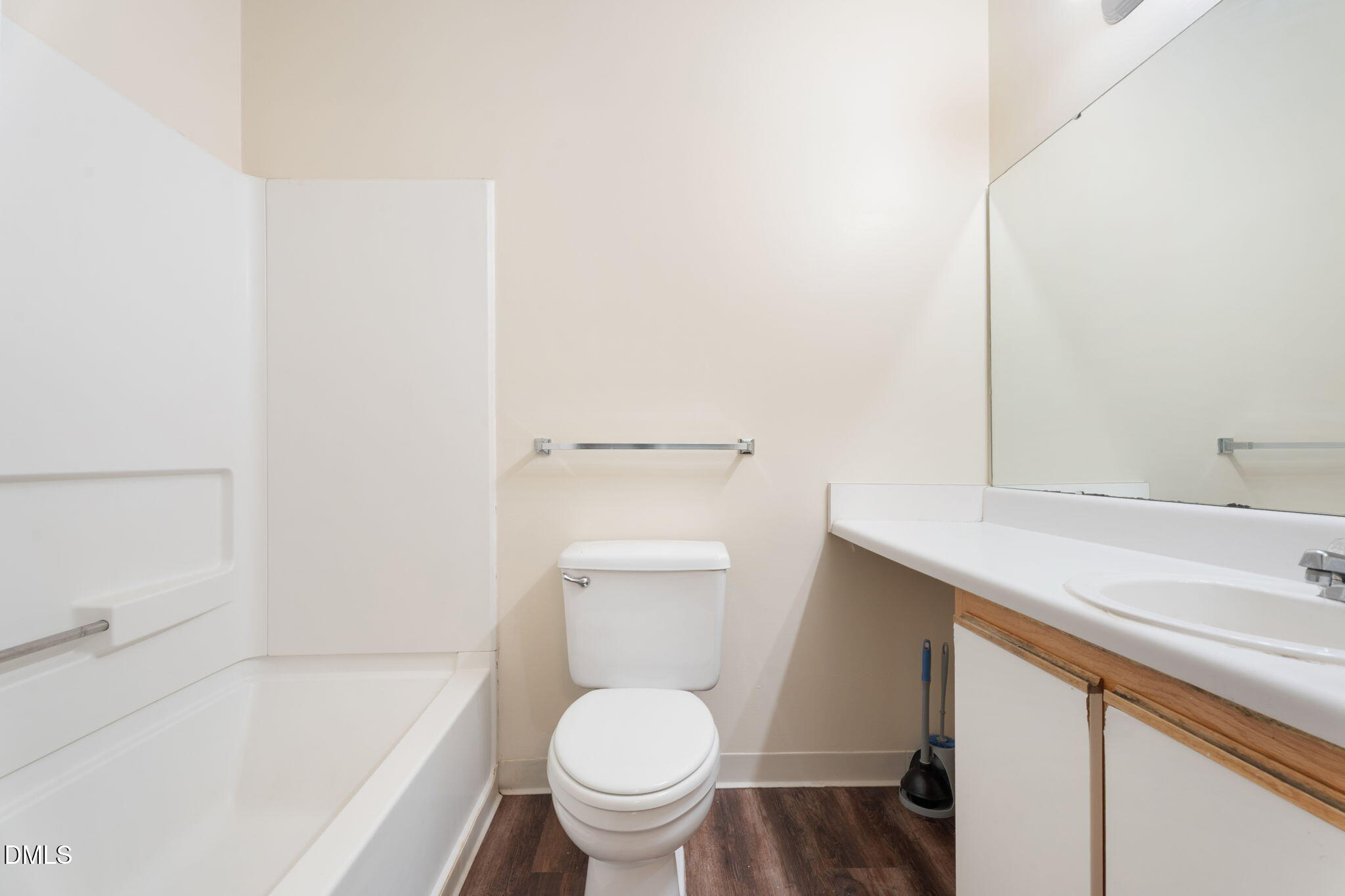 1420 Collegiate Circle Raleigh, NC 27606 - Photo 23 of 30 a white toilet sitting next to a bath tub